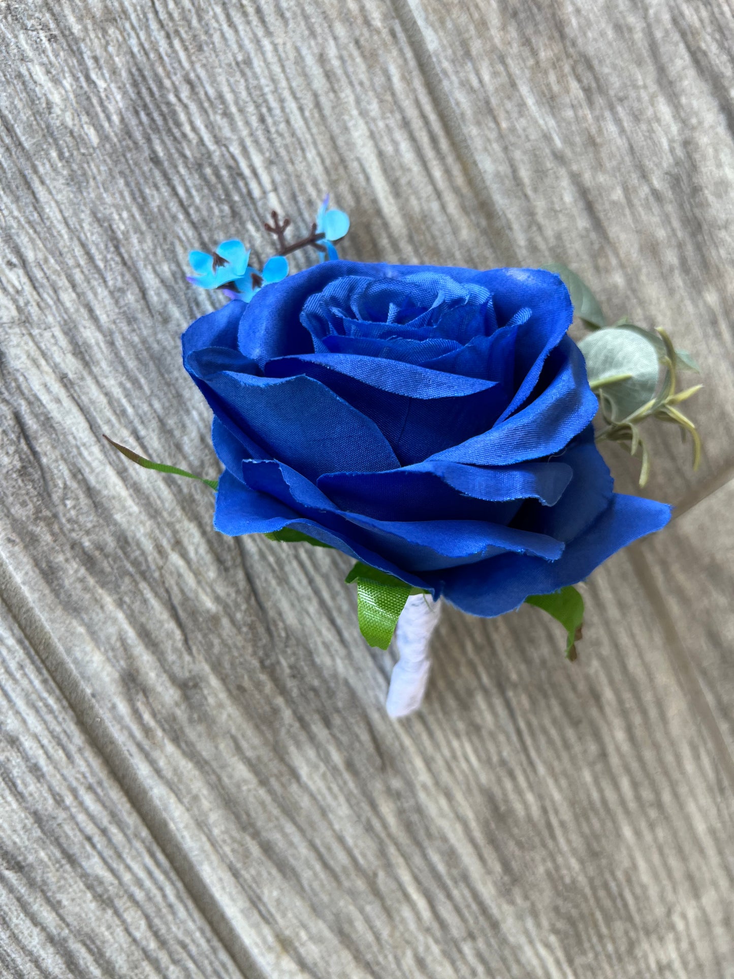 Royal Blue Rose & Turquoise Baby’s Breath Boutonniere